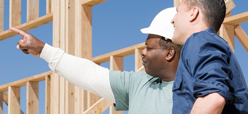 Construction workers talking outside